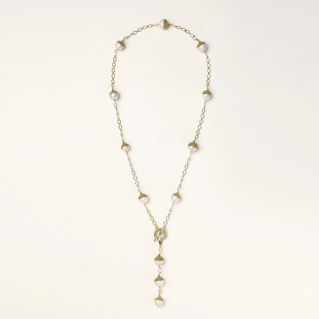 Long gold-plated lariat necklace featuring baroque pearls with metal caps arranged in elegant Y-shape design