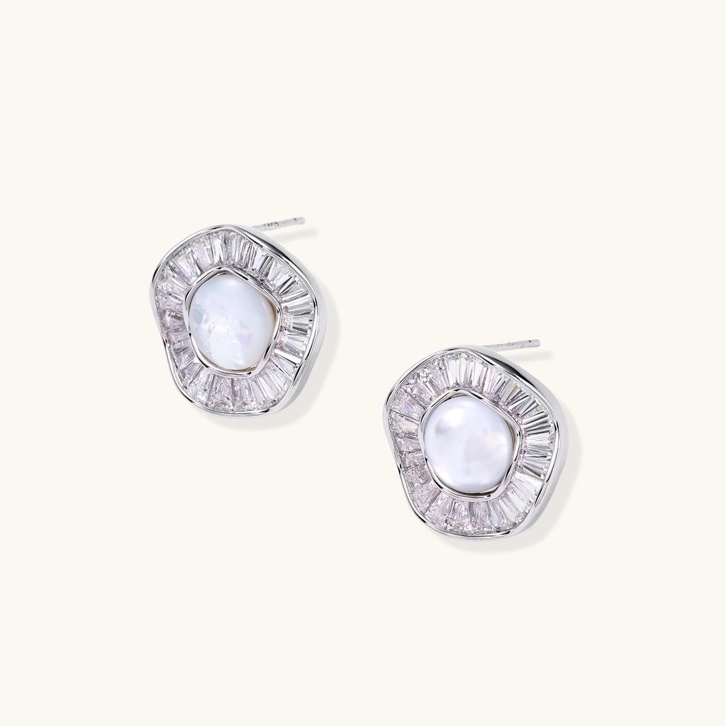 Gold-plated stud earrings with central freshwater pearl surrounded by baguette crystals in radial pattern